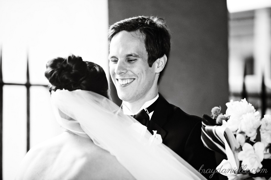 groom smiling at bride first look