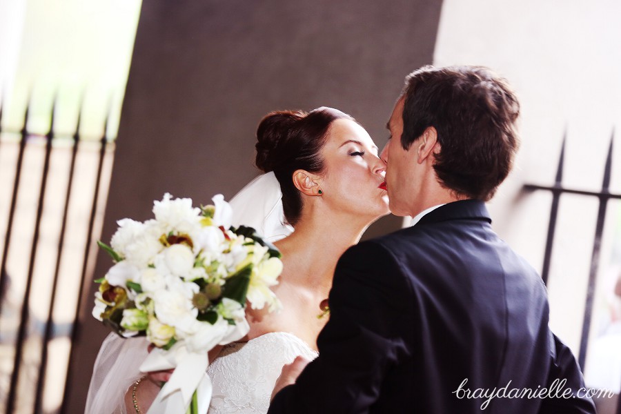 bride and groom kiss first look