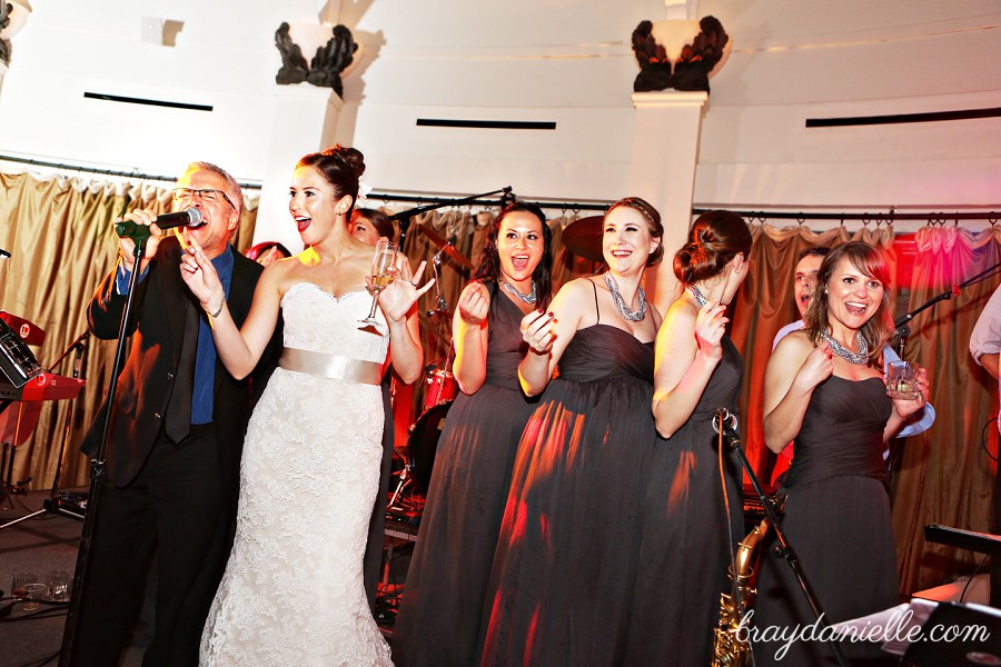 bride singing on stage, wedding by Bray Danielle Photography