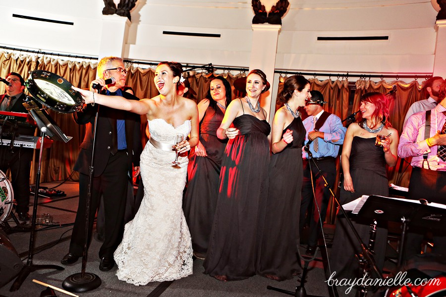 bride singing on stage, wedding by Bray Danielle Photography
