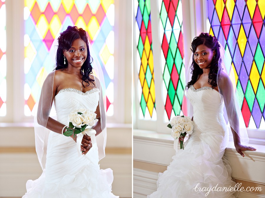 bride by stained glass window by Bray Danielle Photography