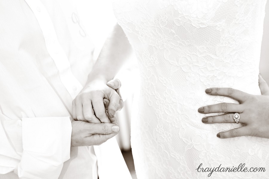 bride and bridesmaid holding hands