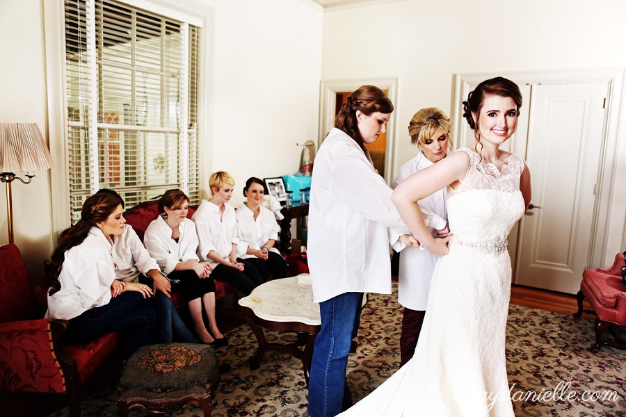 bride getting on dress