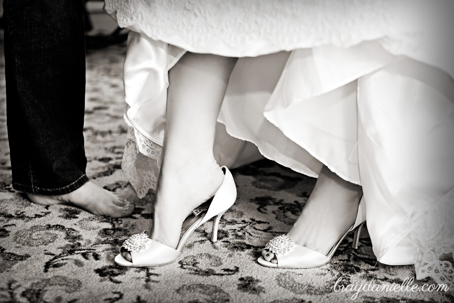 Bride putting on shoes