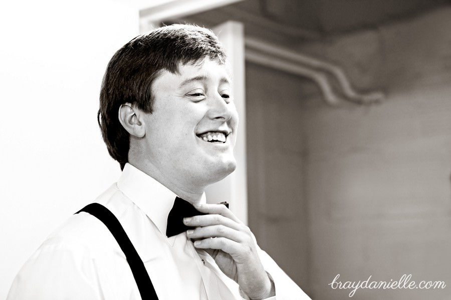 Groom fixing tie