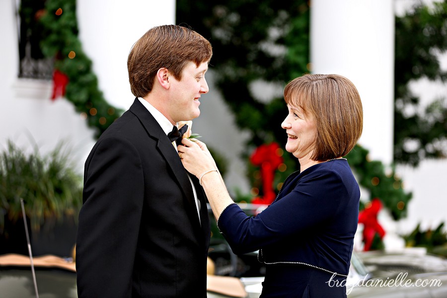 mother of the groom fixing the grooms tie