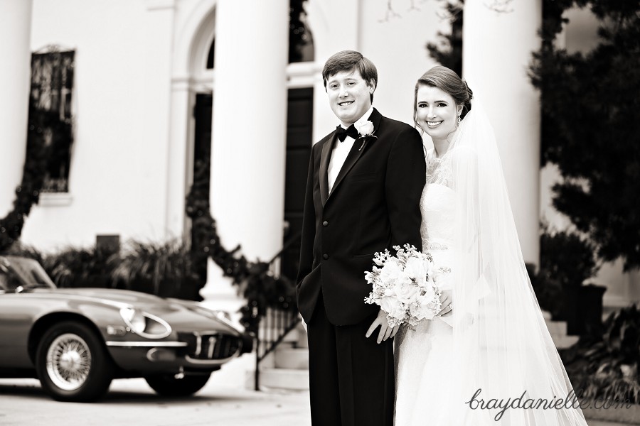 bride and groom by car