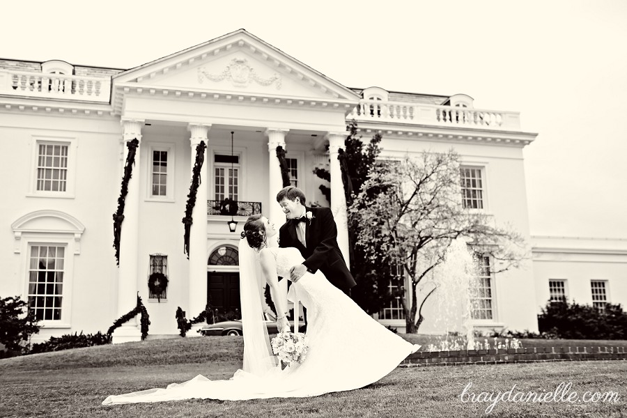portrait of groom dipping the bride