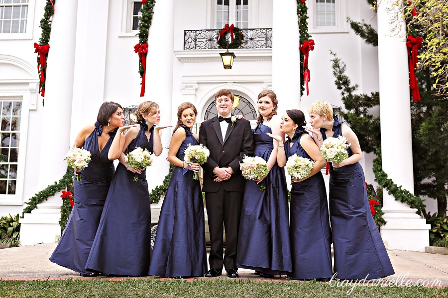 bridesmaid blowing kisses at the groom