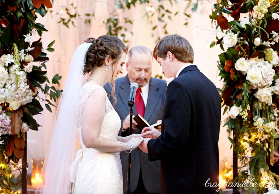 bride and groom exchanging rings