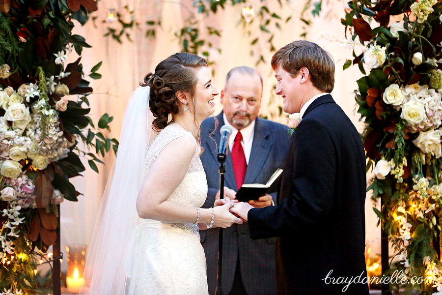 bride and grom exchanging rings