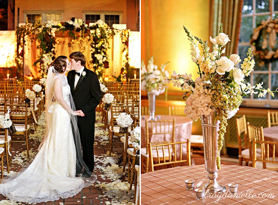 bride and groom kissing in aisle + center pieces