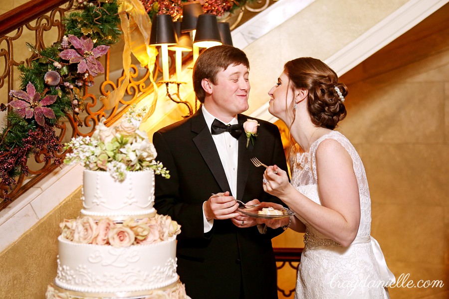 bride and groom eating cake