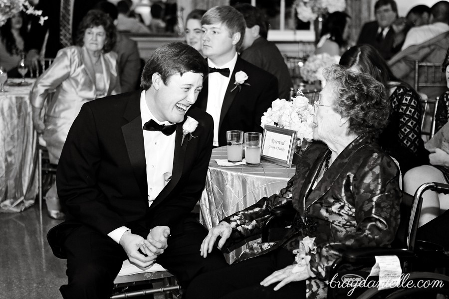 groom laughing with wedding guest