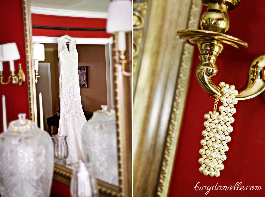 Wedding gown hanging up + pearl bracelet