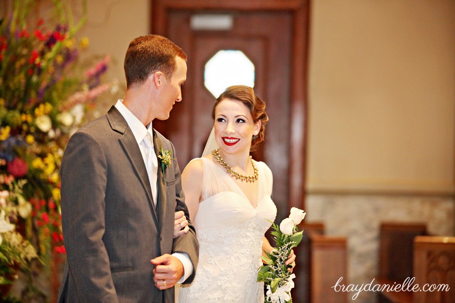 Bride and groom giving out roses