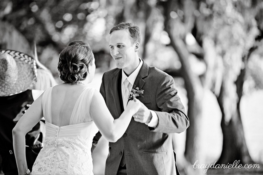 black and white photo of bride & groom dancing