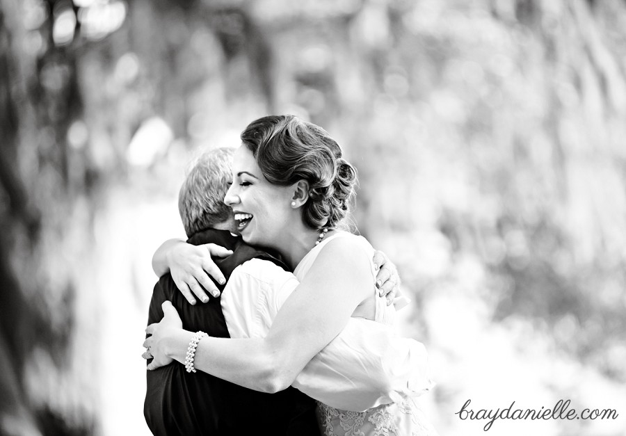 Smiling bride hugging