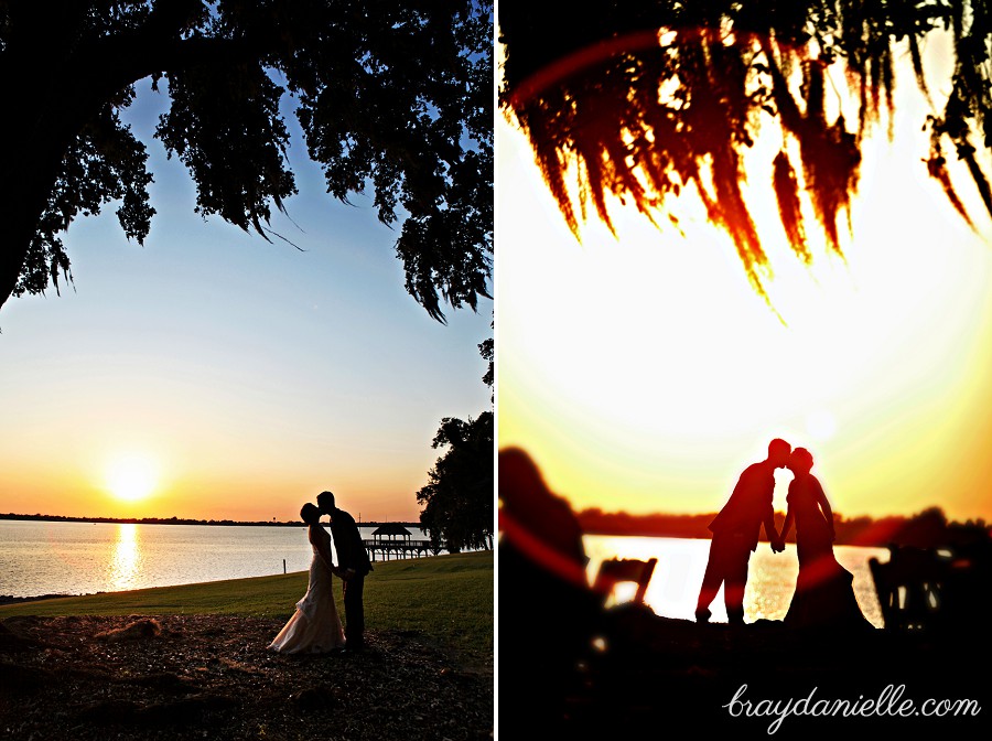  silhouette of bride and groom kissing  at sunset