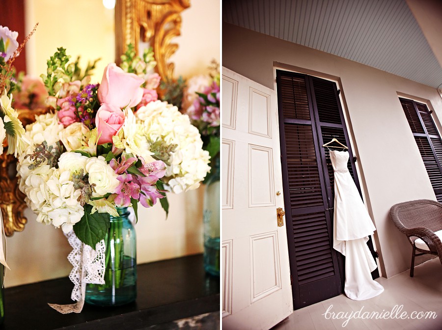 Pink and white bouquet + wedding dress hanging up