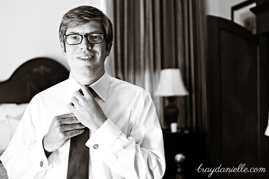 Groom fixing tie