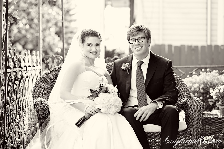 Bride and groom on porch outside