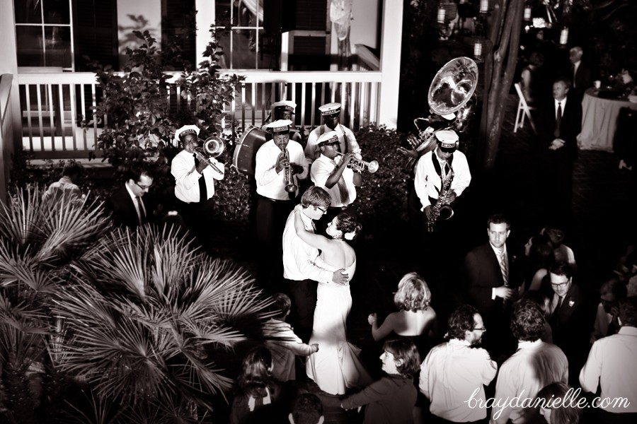 bride and groom dancing with live band