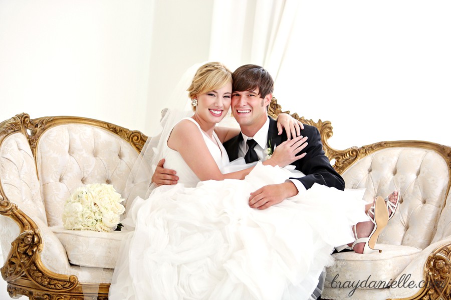 bride sitting on grooms lap