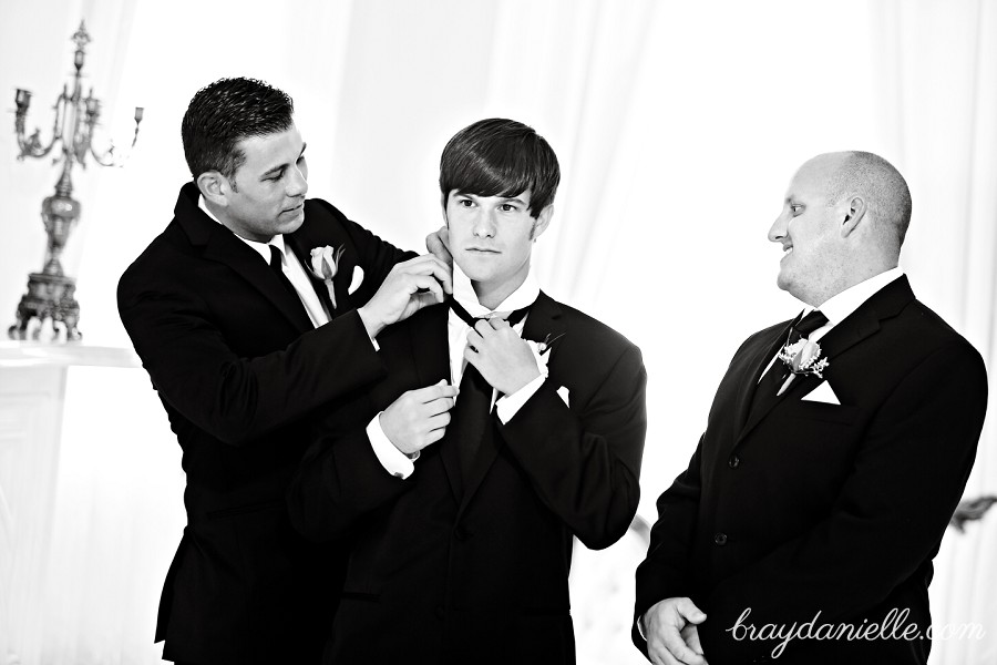 Groom fixing tie