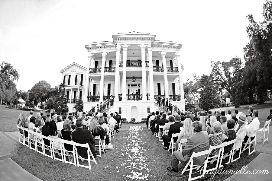 beautiful outdoor wedding ceremony in front of mansion