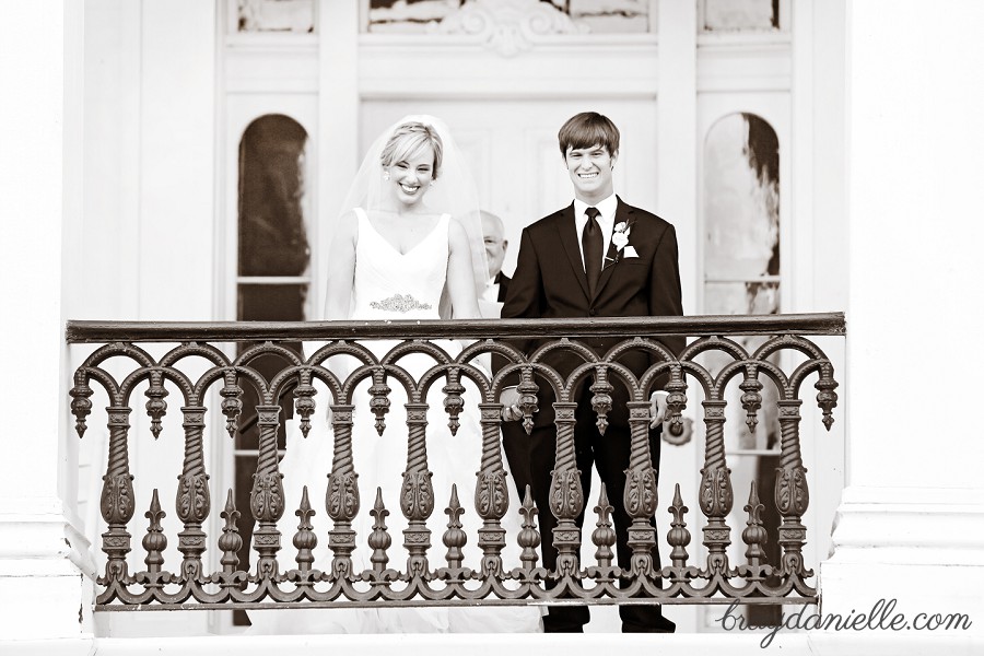 bride and groom on balcony