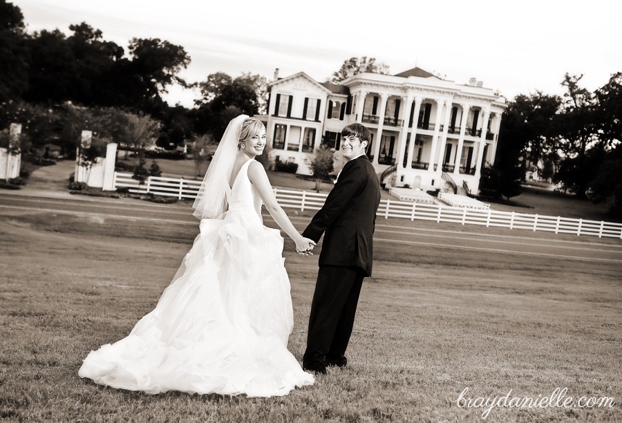 bride and groom holding hands