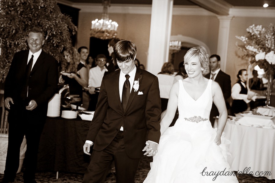 bride and groom enter wedding reception