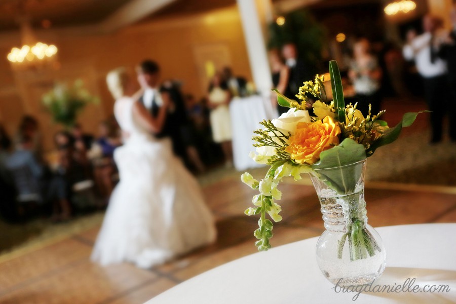 artistic shot of bride and groom dancing