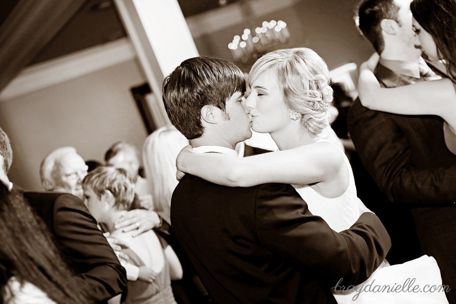 bride and groom kissing on the dance floor