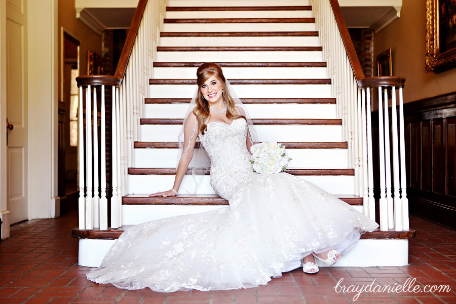 bride sitting on stairs showing shoes by Bray Danielle Photography 