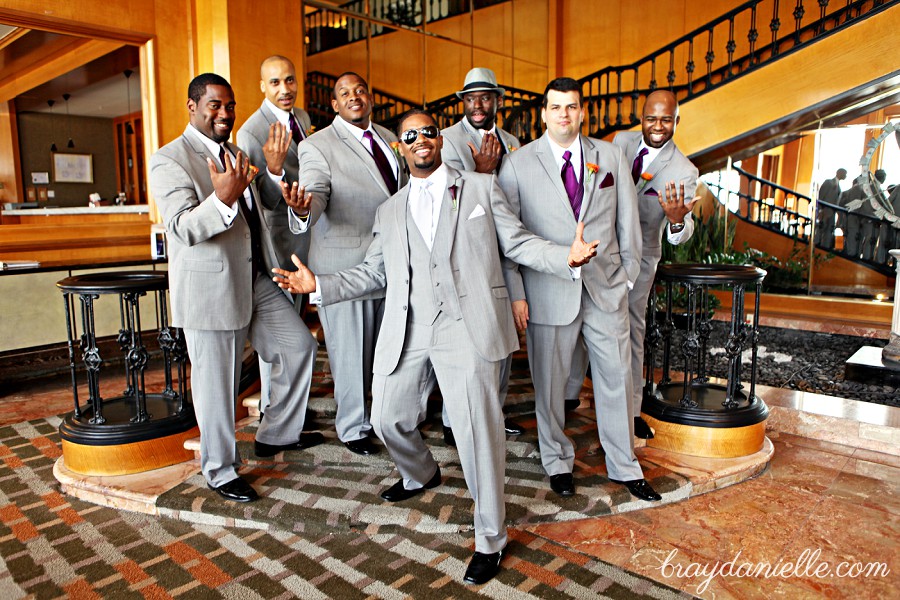 Portrait of groomsmen and groom wearing sunglasses