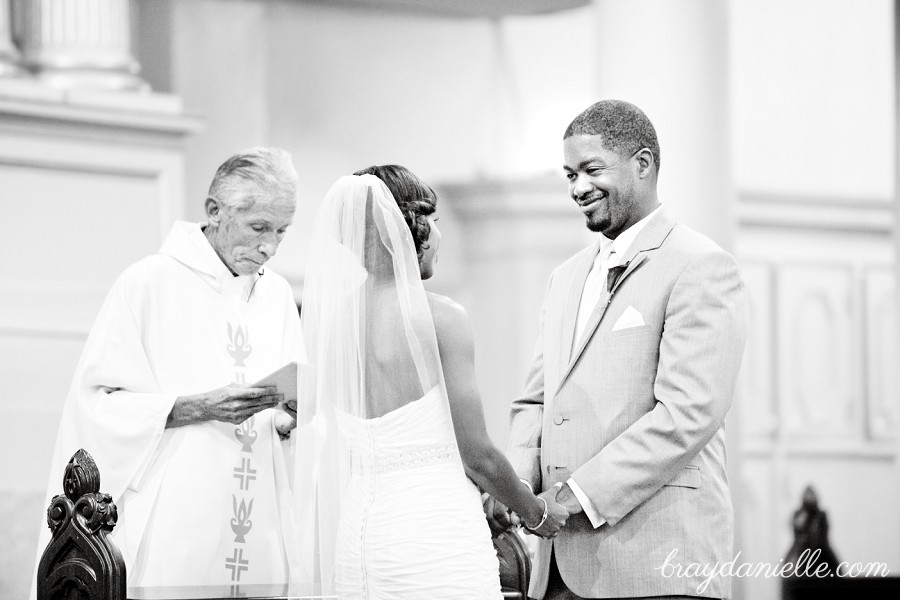 groom smiling at bride at ceremony