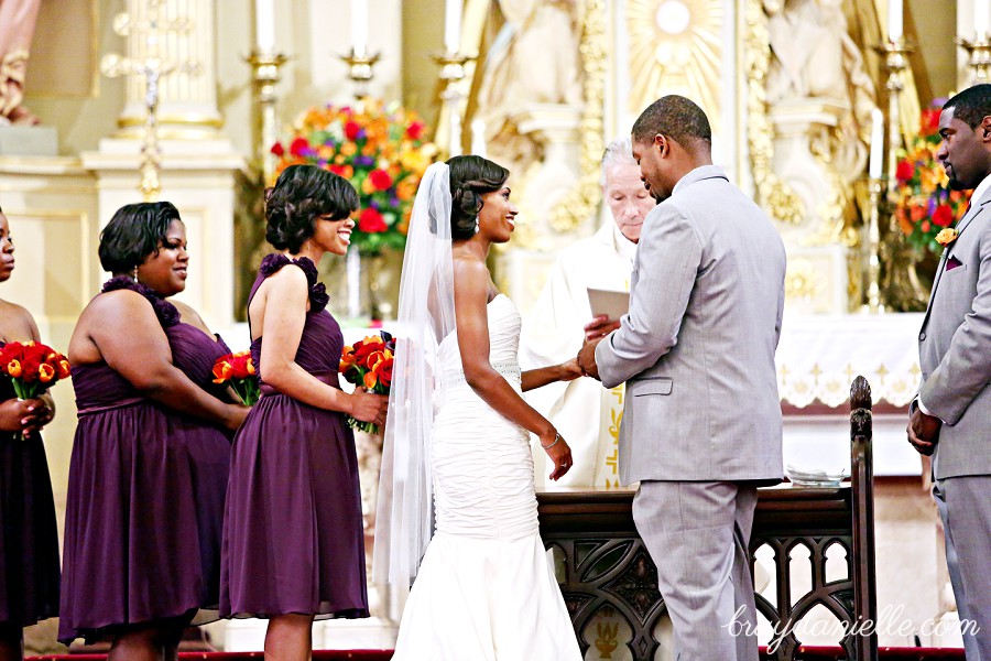 bride and groom exchanging rings