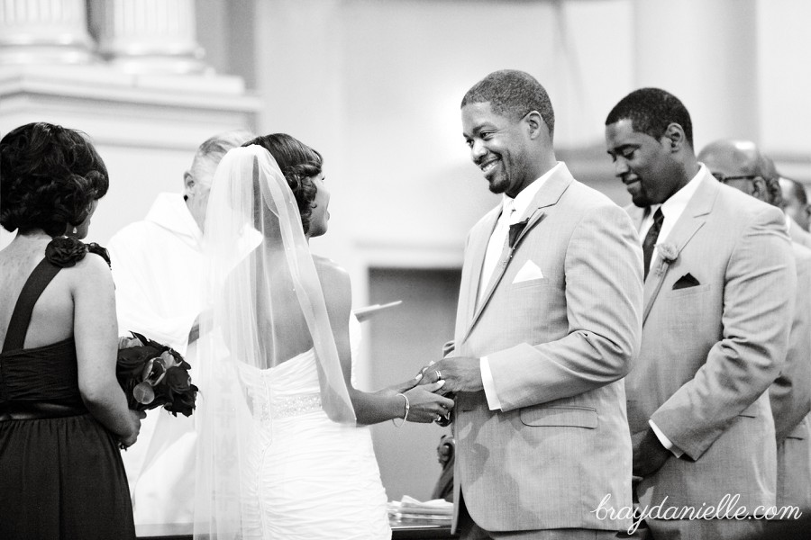 bride and groom holding hands during ceremony