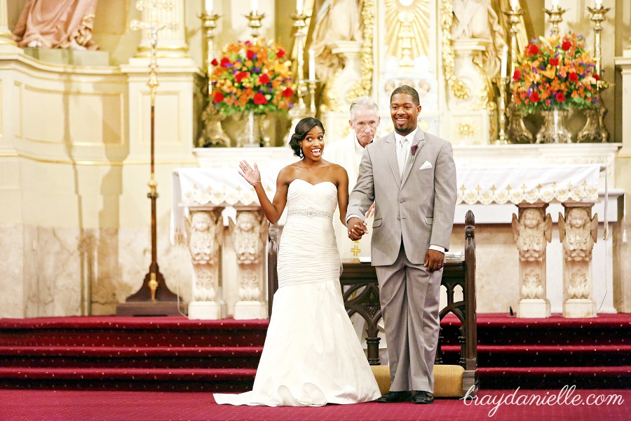 Bride waving during ceremony