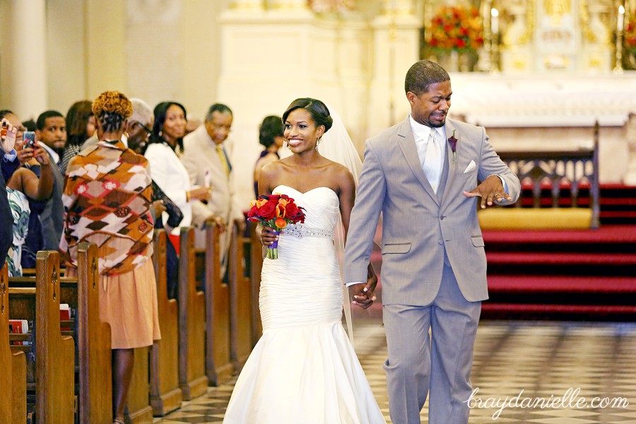 Bride and groom walking down the aisle