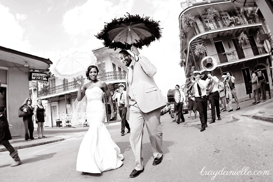 bride and groom walking with jazz band