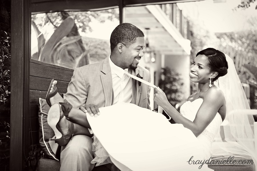 Bride pulling the grooms tie