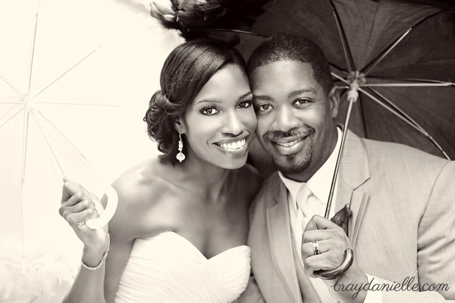 bride and groom under parosels