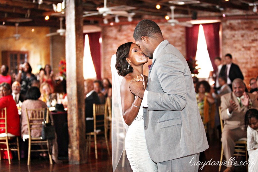 bride and groom kissing while dancing