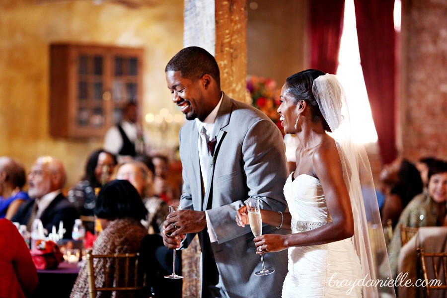 Bride and groom drinking champagne