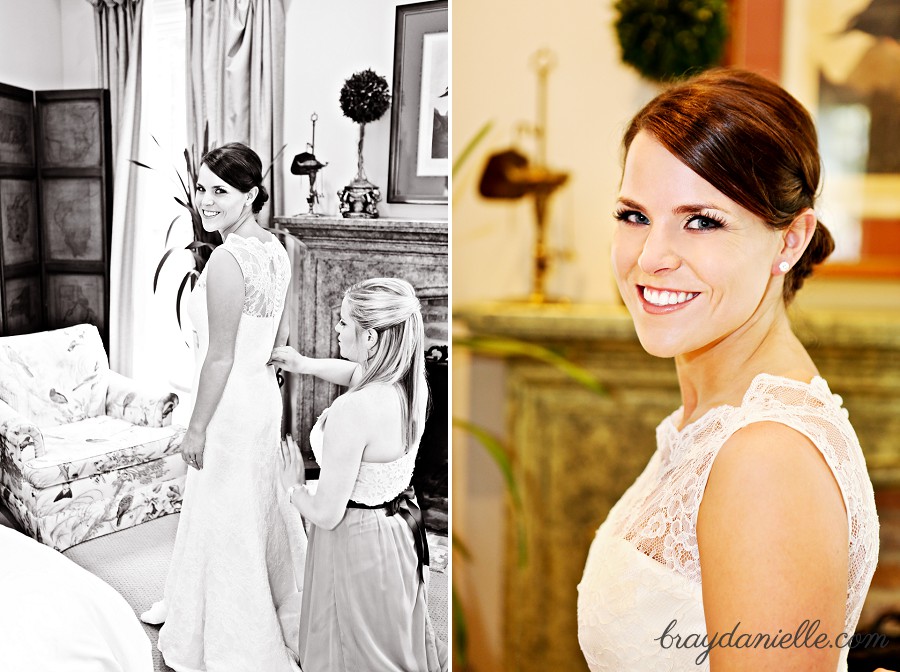 Bride putting on dress