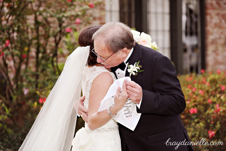 father of the bride hugging