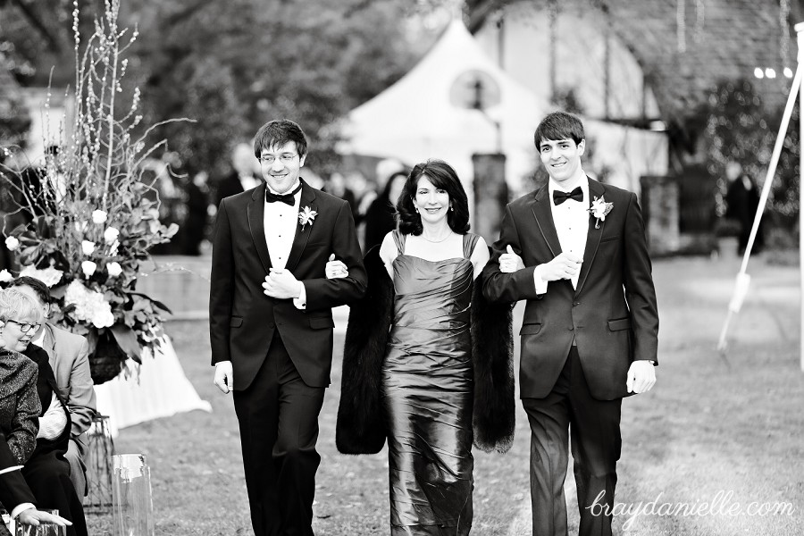 Mother of the groom walking down aisle